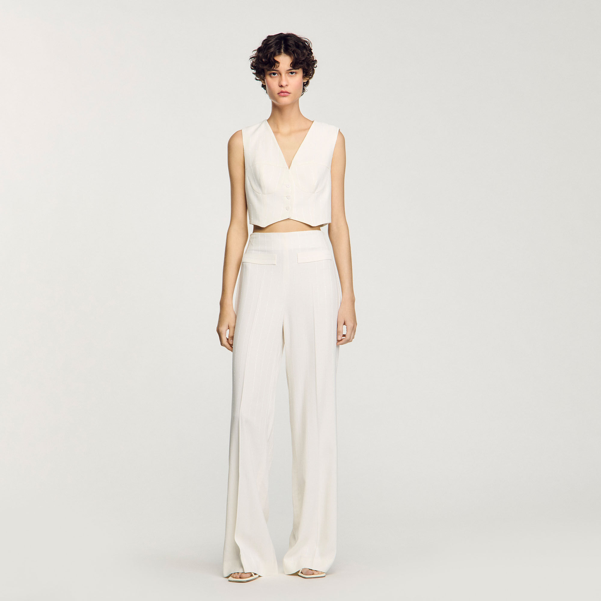 Glittrande kort vest