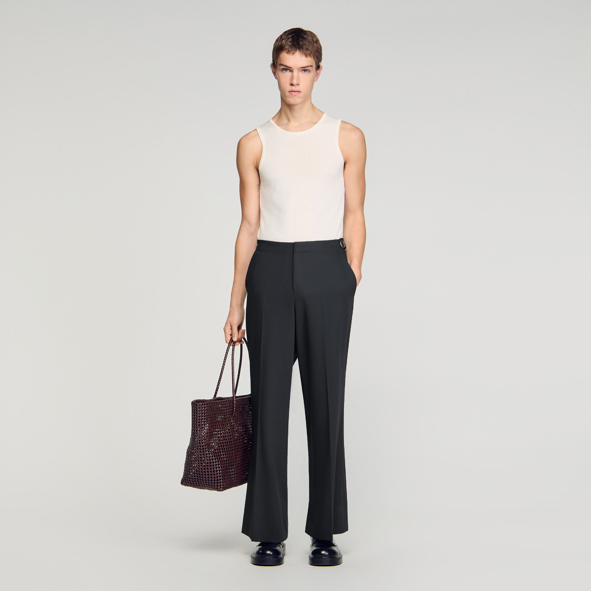 Brede långbyxor i ull med bucklor